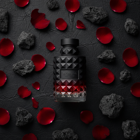 Valentino Uomo Born in Roma Intense flat lay with volcanic rocks and red roses